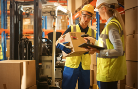 a warehouse supervisor scanning a label