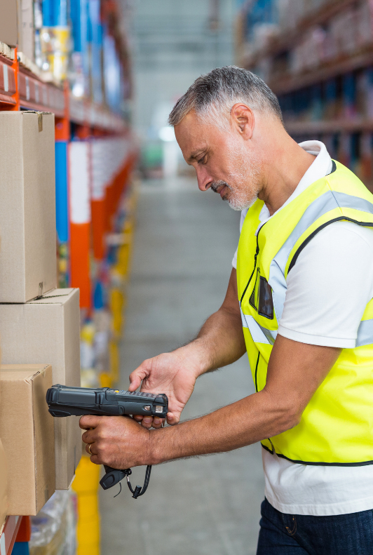 male warehouse working scanning a box