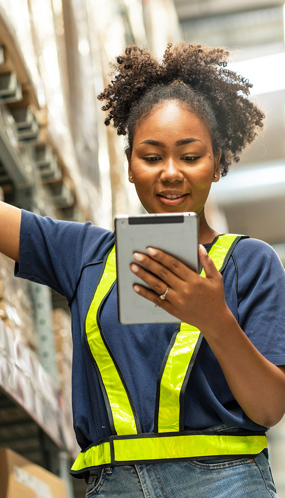 warehouse worker using tablet wms