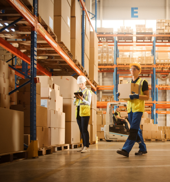 warehouse workers working on seperate tasks warehouse workers working on seperate tasks